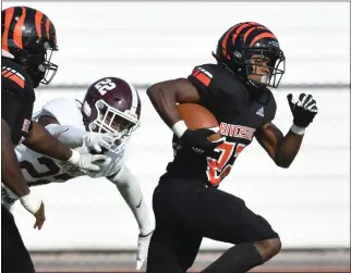  ?? PHOTO BY MILKA SOKO ?? Riverside City College running back Bryce Strong, who breaks away from Mt. SAC’S Lantz Russell for a TD during a National-central Conference game earlier this year, has the Tigers in the SCFA regional title game.