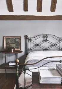  ??  ?? MASTER BEDROOM
The antique English bedstead adds character and has its original paint finish, while the painting propped on the side table brings informalit­y to the space. Dating back to early 19th-century