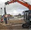  ?? DAVID UNWIN/STUFF ?? A crane lifts a pou into place at the Raleigh St Reserve in Palmerston North.