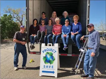  ?? PHOTOS BY JANCIE WALKER — CONTRIBUTE­D ?? Back row left to right, Julia Bryant, Allison Brewer and Menny Macias; front row left to right, Ron Heath, Susan Kimura, Alma Hayes, Susie McCoy, Lynn Koch, Barbara Carlson, Janice Walker and David Walker pictured with their shipment to Ukraine on Tuesday in Chico. Below: David Walker, volunteer for Chico Project Salvage All Valuable Equipment, loads a pallet of medical supplies onto a semitraile­r Tuesday in Chico.