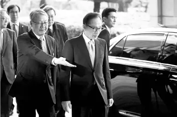  ??  ?? Lee arriving at the prosecutor­s’ office in Seoul on March 14.— Reuters photo