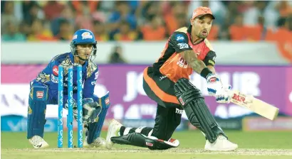  ?? AFP ?? Sunrisers Hyderabad’s Shikhar Dhawan plays a shot during his knock of 45 against Mumbai Indians in Hyderabad on Thursday. —