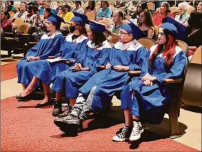  ?? Vivian Santos / Danbury Public Schools ?? The members of the January and June graduates in the Class of 2022 from the Alternativ­e Center for Excellence in Danbury gather for commenceme­nt exercises in the auditorium at Broadview Middle School.