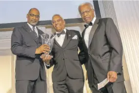  ?? ?? The Chancellor’s Award for Excellence in Global Health Research, Research & Delivery was presented to Dr Farley Cleghorn (centre), chief medical officer and global head, health practices for the Palladium Group by Sir George Alleyne (right), chancellor emeritus, The UWI; and Andre Laveau, consul general of the Republic of Trinidad & Tobago.