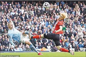  ?? (Pic: Daily Mail) ?? City opened the scoring within two minutes when Erling Haaland’s effort hit Daiki Hashioka.