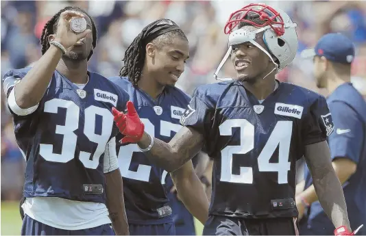  ??  ?? EARLY IMPRESSION­S: New Patriots cornerback Cyrus Jones (24), shown earlier this week with defensive backs E.J. Biggers (39) and Darryl Roberts (27), is already angling for a starting job.