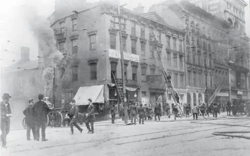  ?? DISPATCH FILE PHOTO ?? A staged scene at the corner of High and Town streets in Downtown Columbus, 1908, when movie-making was fairly new. The Lazarus department store, one of Columbus’ most fondly remembered landmarks, opened at this site the following year.