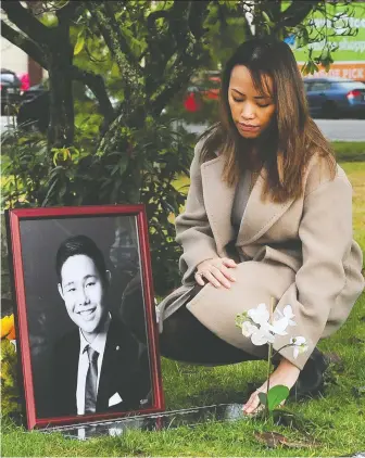  ?? NICK PROCAYLO ?? Krystell Peralta visits her brother Kevin's grave site in Vancouver Sunday. Kevin was 28 when he died on Aug. 23. His sister says her family had to fight to visit him in his care home before he developed infections.