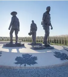  ?? THE CANADIAN PRESS ?? A monument honouring RCMP Constables Fabrice Gevaudan, Dave Ross and Doug Larche, gunned down in 2014, was put up in Moncton, N.B. The RCMP has been ordered to pay $550,000 for failing to provide its members with proper equipment and training in the...