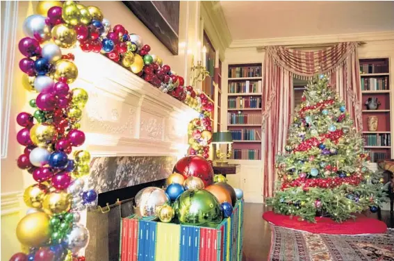  ?? ANDREW HARNIK/ASSOCIATED PRESS PHOTOS ?? The Library of the White House is decorated for the holidays. More than 90 decorators from 33 states, D.C. and Puerto Rico were involved in the White House preparatio­ns.