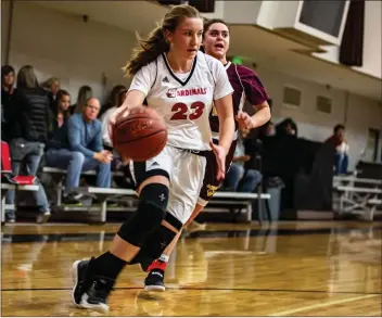  ?? Cory Rubin/The Signal (See additional photos on signalscv.com) ?? Santa Clarita Christian’s Emily Bernards drives to the hoop in a matchup with de Toledo High School at SCCS Monday night. The Cardinals rode a strong defensive performanc­e to a 60-8 win over the Jaguars.