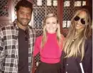  ?? PHOTO COURTESY OF CHICAGO CUT STEAKHOUSE ?? Seattle Seahawks quarterbac­k Russell Wilson and his fiancée, pop star Ciara (right), pose with a Chicago Cut hostess.