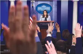  ?? THE ASSOCIATED PRESS ?? White House press secretary Sarah Huckabee Sanders listens to a reporter’s question during the daily briefing at the White House in Washington on Wednesday.