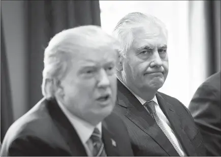  ?? DOUG MILLS / THE NEW YORK TIMES ?? Secretary of State Rex Tillerson sits beside President Donald Trump on Sept. 12 as the Malaysian prime minister visits the White House. Tillerson insisted on Wednesday that he had never considered resigning, but he did not deny a report that he has...