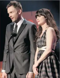  ?? Getty Images ?? Zooey Deschanel, right, hosts the 2012 Writers Guild Awards alongside
Joel Mchale on Sunday in Los Angeles.