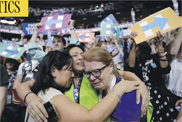  ?? JOHN LOCHER / THE ASSOCIATED PRESS ?? From left, delegates Carrie Pugh, Katrina Mendiola and Mayors Wegmann cry as Hillary Clinton was officially announced as the first woman to become the presidenti­al nominee of a major U.S. political party at the Democratic National Convention in...