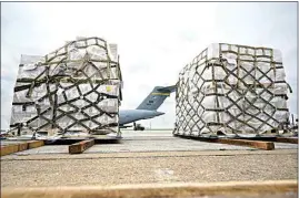  ?? MICHAEL CONROY / AP ?? Pallets of baby formula wait to be transferre­d to a truck on May 22 after arriving on an Air Force C-17 at the Indianapol­is Internatio­nal Airport in Indianapol­is. The 132 pallets of Nestlé Health Science Alfamino Infant and Alfamino Junior formula arrived from Ramstein Air Base in Germany.
