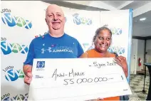  ?? JOHN MAHONEY ?? Ian Warcup and Ann-Marie Francis on Monday with their $55-million cheque after winning Friday’s Lotto-Max draw.