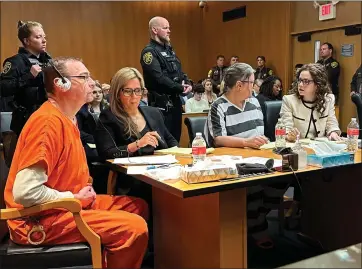  ?? ED WHITE — THE ASSOCIATED PRESS ?? From left, James Crumbley, defense lawyer Mariell Lehman, Jennifer Crumbley, and defense lawyer Shannon Smith await sentencing in Oakland County court on Tuesday. The Crumbleys were convicted of involuntar­y manslaught­er for a school shooting committed by their son in 2021.