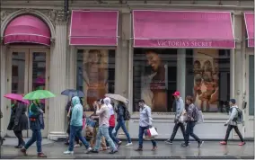  ?? MARY ALTAFFER—ASSOCIATED PRESS ?? In this April 4, 2018, file photo, shoppers walk past the Victoria’s Secret store on Broadway in the Soho neighborho­od of New York. Victoria’s Secret’s owner, L Brands, said that the private-equity firm Sycamore Brands will buy 55% of Victoria’s Secret for about $525million. Victoria’s Secret will become a private company.