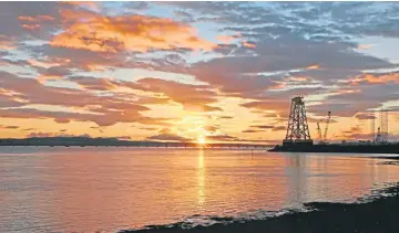  ?? ?? Thanks to Eric Niven for this eye-catching picture of a lovely sunset over the River Tay, which he took during a break while on a cycle ride along the Stannergat­e in Dundee.