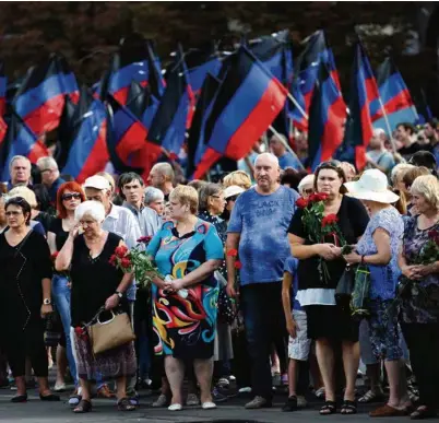  ?? (ALEKSEY FILIPPOV/AFP PHOTO) ?? Les funéraille­s d’Alexandre Zakhartche­nko, dimanche à Donetsk.