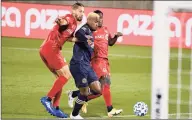  ?? Jessica Hill / Associated Press ?? Philadelph­ia Union’s Sergio Santos, center, cuts between Toronto FC’s Omar Gonzalez, left, and Richie Laryea to score during the first half Saturday in East Hartford.