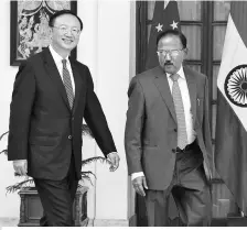  ?? PHOTO: REUTERS ?? File photo of National Security Advisor Ajit Doval (right) and his Chinese counterpar­t Yang Jiechi . The two met in Beijing on Thursday on the sidelines of a BRICS meeting, amid an ongoing military stand-off between the two nations in Sikkim