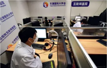  ??  ?? A doctor in Tianjin offers consultati­on from an online hospital on March 3, 2020