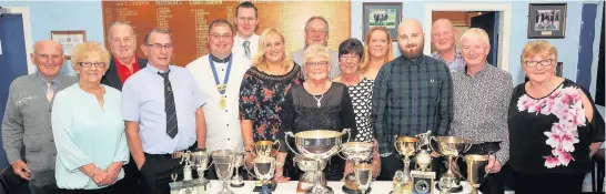  ??  ?? Peter Boyle Winners are pictured at their annual awards night. Gents triples: G Allan, S Dunlop, W Young, r- up: W Dunlop, D Sim, St Dunlop; H B Carey: Scott McKnight, r- up: Daniel Sim; Drawn mixed pairs: Joyce Kennedy and Sam Dunlop, r- up: Helen Dunlop and Willie Young; gents senior singles: Ian Howarth, r- up: John Jackson; senior pairs: Sam Dunlop and John Jackson, r- up: Kenny Thomson and John Martin; gents championsh­ip: Sam Dunlop, r- up: Scott McKnight; presidents: Stewart Dunlop, r- up: Gary Kennedy; Peter Boyle Cup: Kenny Thomson, r- up: John Jackson; novice: Cameron Kennedy, r- up: Drew Reid; pairs: Daniel Sim and Stewart Dunlop, r- up: Gary and Cameron Kennedy; ladies championsh­ip: Joyce Kennedy, r- up: Katrina Magill; Worthingto­n: Joyce Kennedy, r- up: Elaine Flannigan; handicap: Michelle Kennedy, r- up: Joyce Kennedy; ladies pairs: Helen Dunlop and Joyce Kennedy, r- up: Elaine Flannigan and Susan Bell.