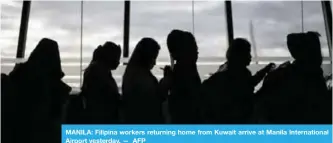  ??  ?? MANILA: Filipina workers returning home from Kuwait arrive at Manila Internatio­nal Airport yesterday. — AFP