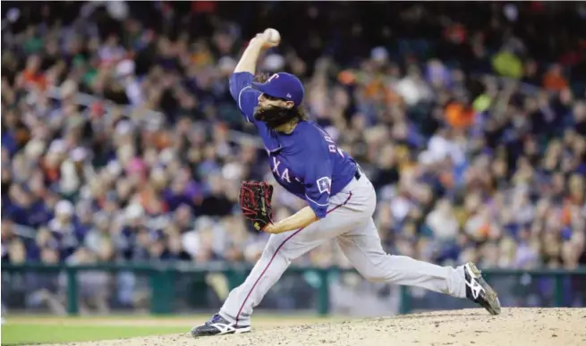  ?? —AFP ?? DETROIT: Tony Barnette #43 of the Texas Rangers pitches against the Detroit Tigers during the sixth inning at Comerica Park.