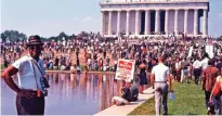  ??  ?? This image released by Magnolia Pictures shows people gathering at the Lincoln Memorial for the March on Washington, featured in the film, "I Am Not Your Negro."