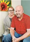  ??  ?? Bryan Williams and his wife, Carla, discuss the quality of life improvemen­ts they have experience­d since Bryan, 45, underwent brain surgery to relieve Parkinson’s disease symptoms.