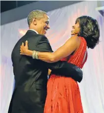  ?? Photos: Washington Post ?? Power outfits: Michelle Obama in the jacquard Thom Browne outfit and the red inaugurati­on ball gown designed by Jason Wu.