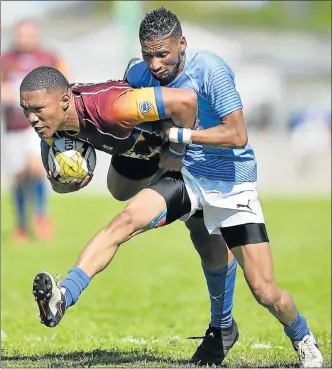 ?? Picture: GALLO IMAGES/ASHLEY VLOTMAN ?? STOP ZONE: Wilbre van Wyk, of Tygerberg, is tackled by Raymond Darries, of Uitenhage team Progress, during their Gold Cup match at Florida Park in Cape Town last weekend