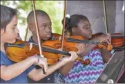  ?? GARY GOLD PHOTO ?? Children perform in the Empire State Youth Orchestra, which will be featured at the upcoming first-ever Festival of Young Artists at Saratoga Performing Arts Center.