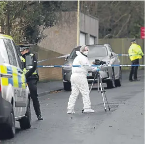  ?? Pictures: Kris Miller. ?? Police and forensic experts combed the scene after the 17-year-old was found badly injured in Adelaide Place.