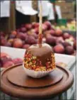  ?? PHOTO BY EMILY RYAN ?? Sprinkles add a festive touch to a Highland Orchards’ caramel apple.