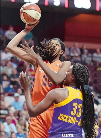  ?? SEAN D. ELLIOT/THE DAY ?? Connecticu­t’s Jonquel Jones shoots over Tiffany Jackson-Jones during the Sun’s 87-79 loss to the Los Angeles Sparks on June 27 at Mohegan Sun Arena. It’s been a breakthrou­gh season for Jones, who is coming off a dominating performanc­e at Saturday’s...