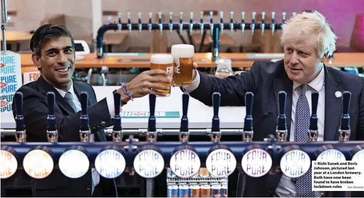  ?? Dan Kitwood ?? > Rishi Sunak and Boris Johnson, pictured last year at a London brewery. Both have now been found to have broken lockdown rules