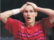  ?? JANE BARLOW / PA VIA AP ?? Denmark’s Viktor Axelsen reacts after beating five-time winner Lin Dan on Sunday to take the men’s singles gold at the World Badminton Championsh­ips in Glasgow, Scotland.