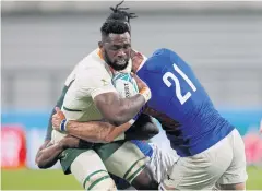  ?? AFP ?? South Africa’s Siya Kolisi, left, in action against Namibia.