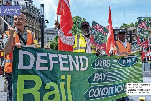  ?? ?? RMT union members picket outside Victoria train station in London yesterday