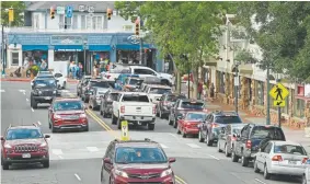  ?? Helen H. Richardson, The Denver Post ?? Cars sit in traffic as they wait to get on West Elkhorn Avenue on Aug. 5 in Estes Park. In the summer tourist months, Estes Park balloons from its winter population of about 7,000 to as many as 3 million people.