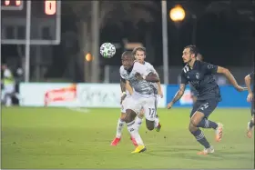  ?? SUBMITTED PHOTO — PHILADELPH­IA UNION ?? Union forward Sergio Santos, here sprinting past Sporting Kansas City defender Roberto Puncec Thursday night, had two goals and an assist in a 3-1 win in the MLS Is Back quarterfin­als.