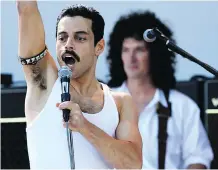 ??  ?? Rami Malek portrays Freddie Mercury as both a strutting peacock and a human being, aware of his musical genius and his shortcomin­gs.