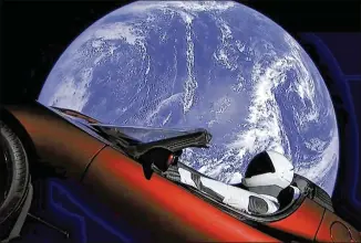  ?? SPACEX VIA ASSOCIATED PRESS ?? This image from video provided by SpaceX shows the company’s spacesuite­d mannequin, “Starman,” in Elon Musk’s red Tesla Roadster, which was launched into space during the first test flight of the Falcon Heavy rocket on Tuesday.