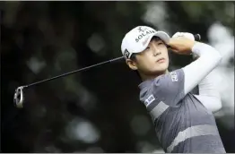  ?? STEVEN PASTON — PA VIA AP ?? South Korea’s Park Sung-hyun plays off the 12th tee on day one of the AIG Women’s British Open at Woburn Golf Club, Little Brickhill, England, Thursday.