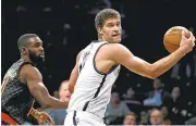  ?? ADAM HUNGER/ASSOCIATED PRESS ARCHIVES ?? Nets center Brook Lopez may be headed to the Los Angeles Lakers in a bold trade, according to several insiders.